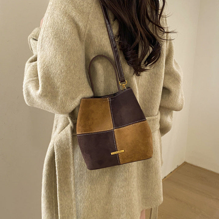 Women’s mini hobo bag made of high-quality suede leather with decorative stitching