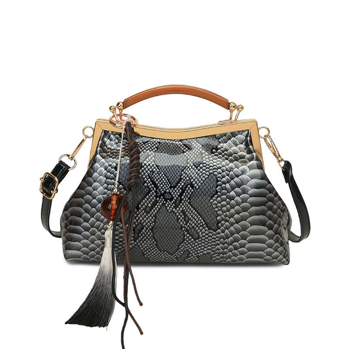 Ladies elegant tote bag in stylish snake leather look