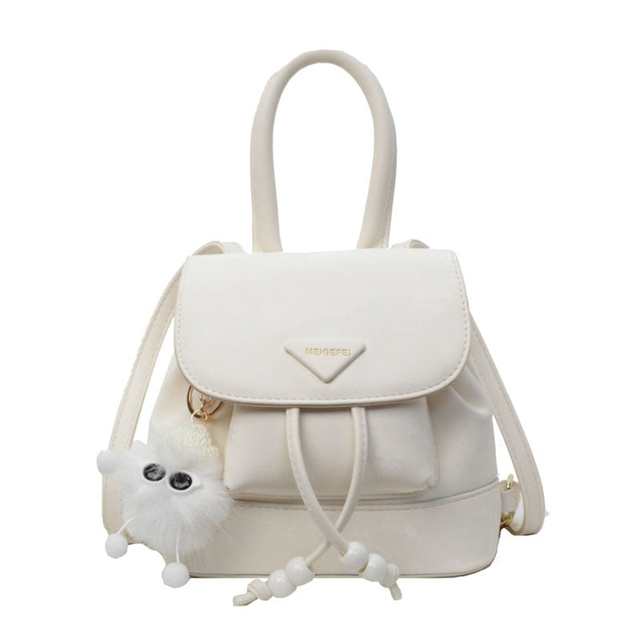 Women's mini backpack with playful design and plush pendant