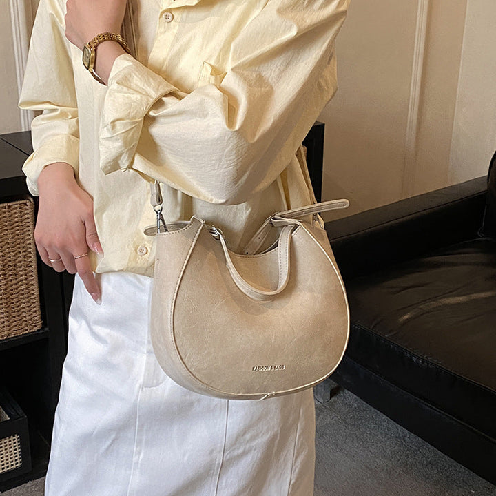 Women's shoulder bag made of high-quality artificial leather with fashionable trim