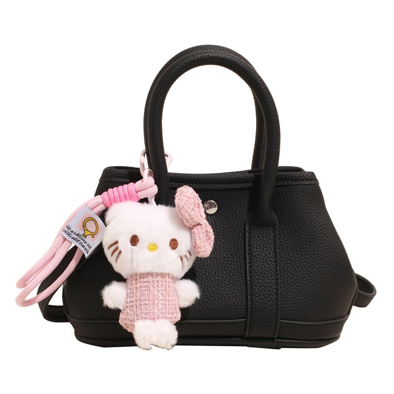 Women’s mini handbag with playful plush pendant