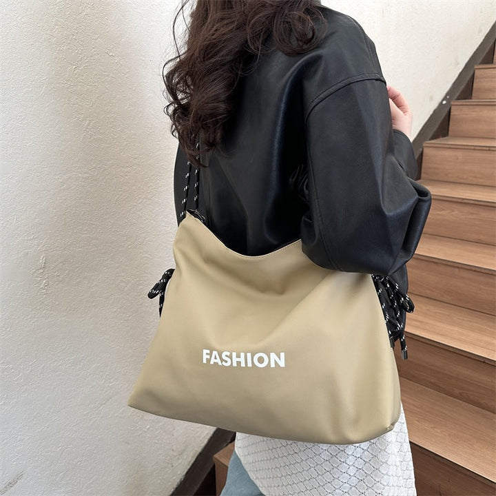 Women's stylish tote bag with braided drawstring
