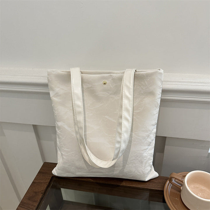 Women's tote bag made of high-quality synthetic leather with a textured surface