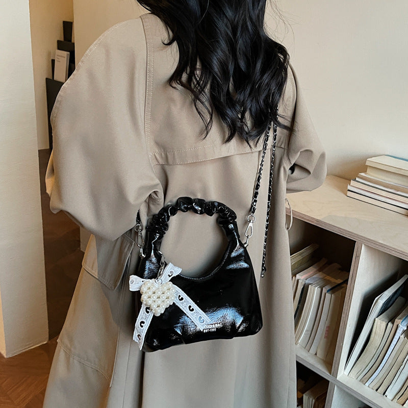Ladies mini handbag with voluminous ruffle design and trendy charms