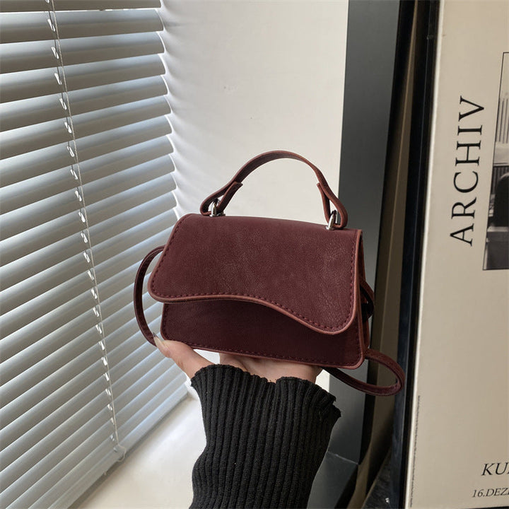 Women's mini handbag with removable carry handle