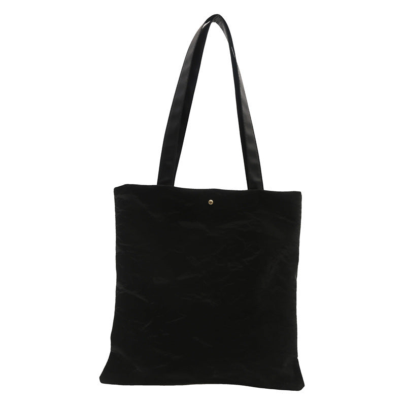 Women's tote bag made of high-quality synthetic leather with a textured surface