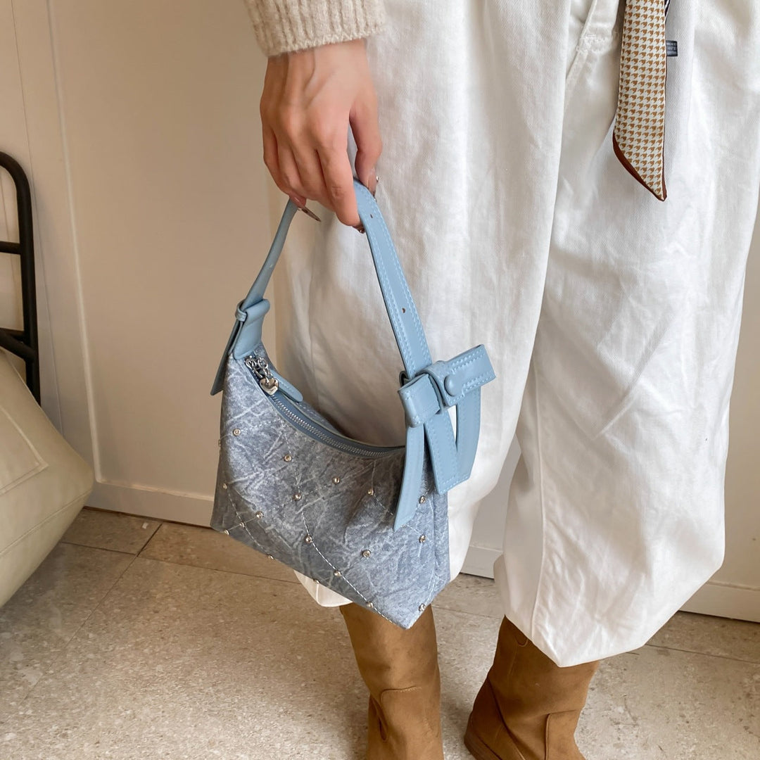 Ladies fashionable shoulder bag with sparkling appliqués