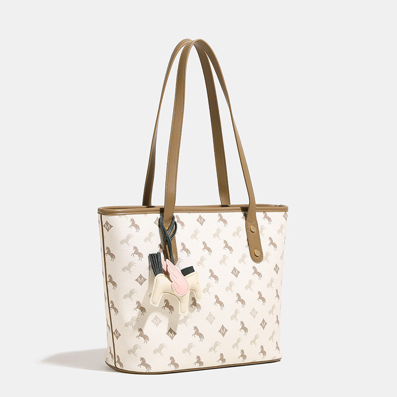 Women's casual tote bag with playful design and detachable pendant