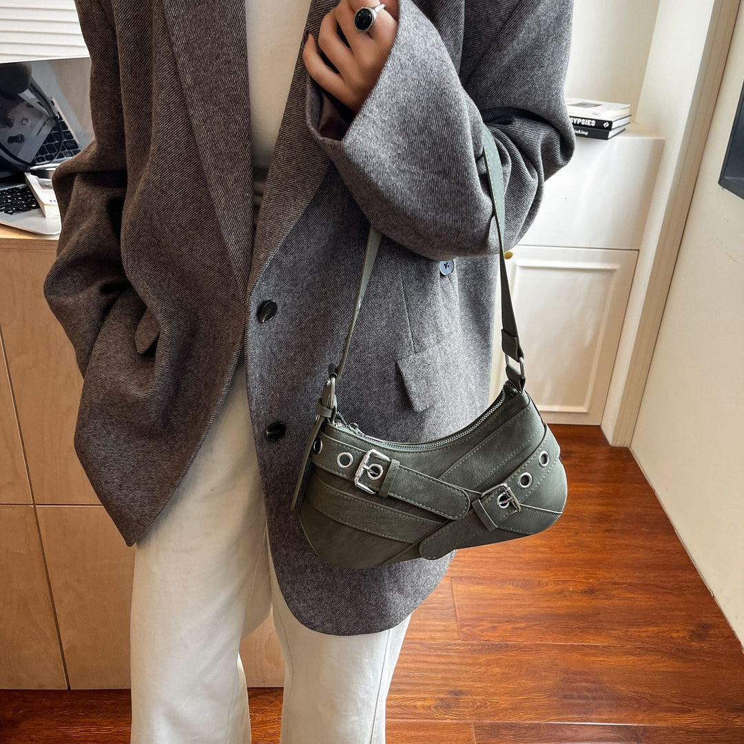 Women's fashionable shoulder bag made of soft suede leather with unique appliqué