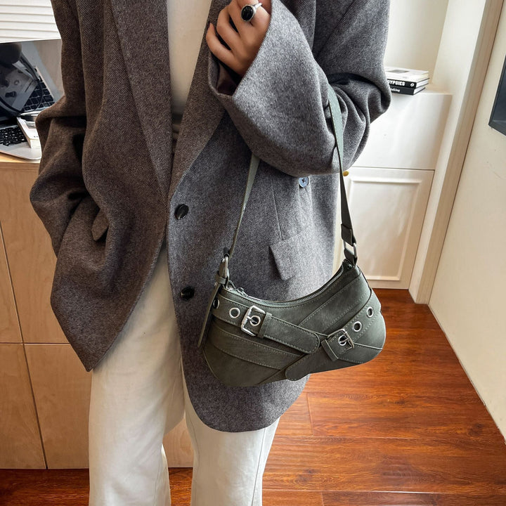 Women's fashionable shoulder bag made of soft suede leather with unique appliqué