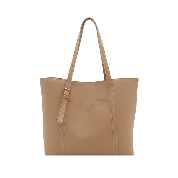 Women's tote bag made of structured synthetic leather with stylish detail