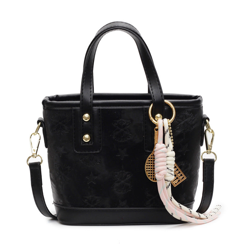 Ladies mini bag in playful design with decorative charm