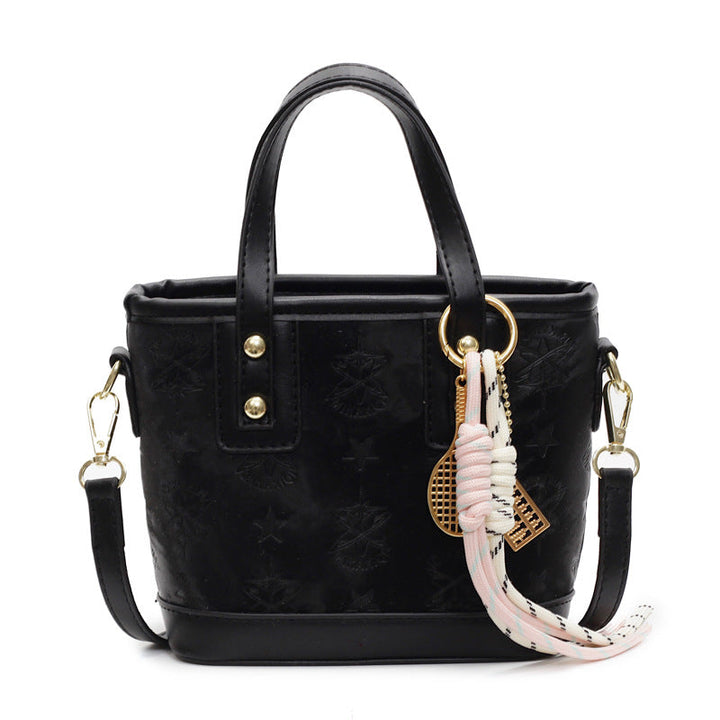 Ladies mini bag in playful design with decorative charm
