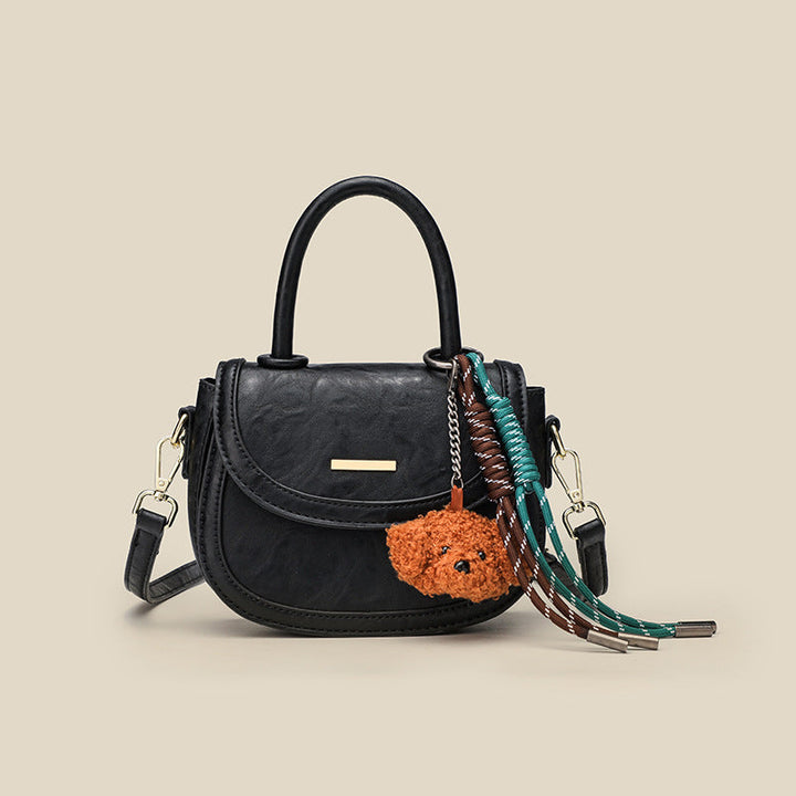 Women's mini handbag with playful detail and high-quality faux leather