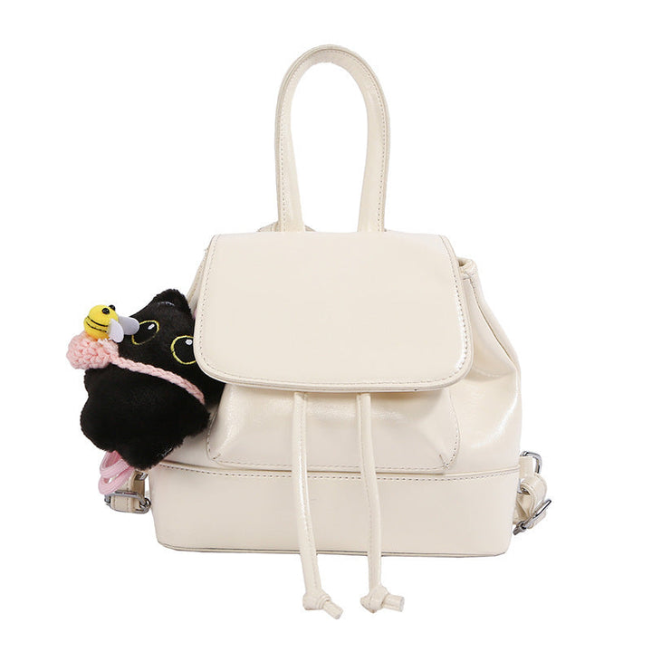 Women's mini backpack with playful pendant