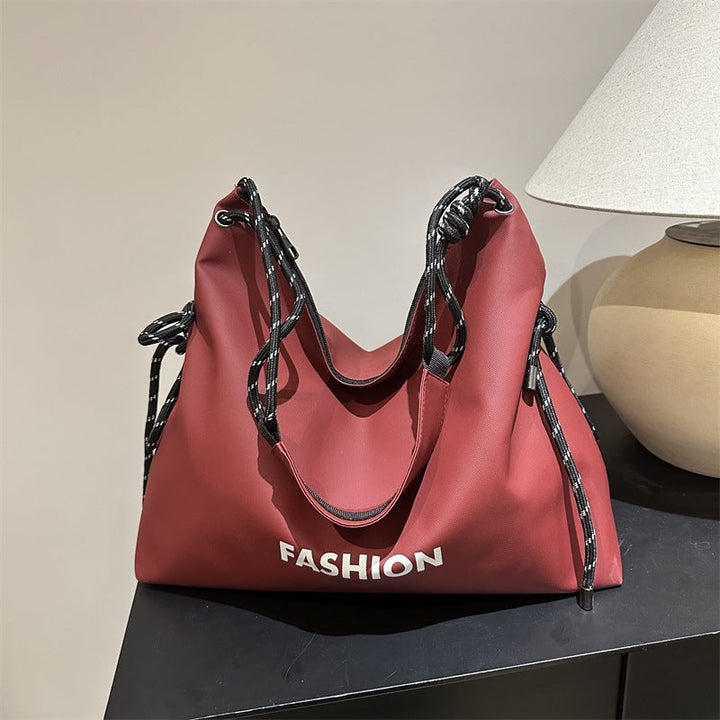 Women's stylish tote bag with braided drawstring