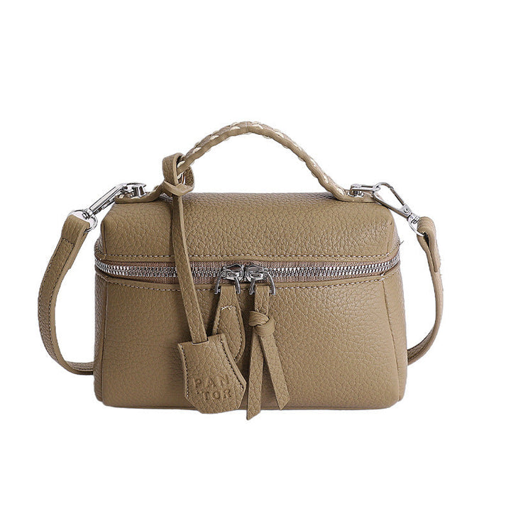 Women's mini handbag with fine decorative seams and detachable shoulder strap