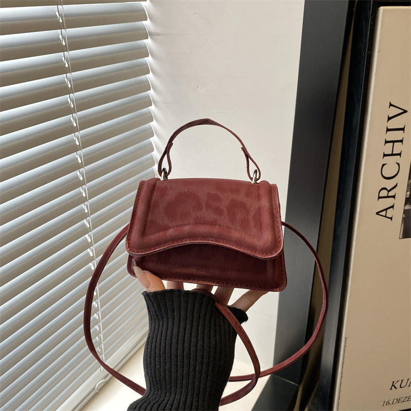 Ladies' mini handbag in retro style with removable shoulder strap