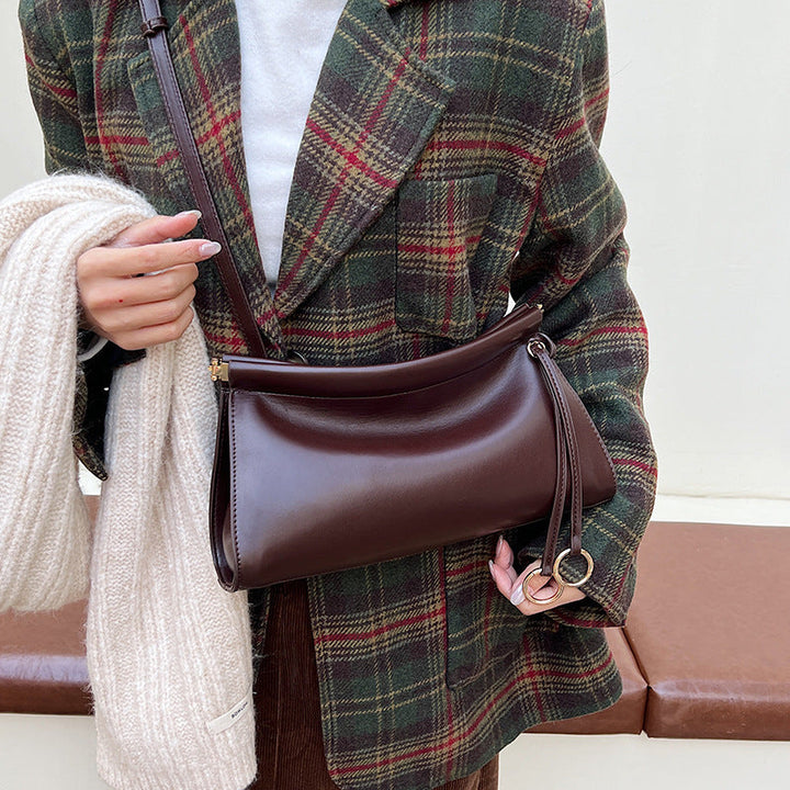 Women's elegant shoulder bag with modern, curved design