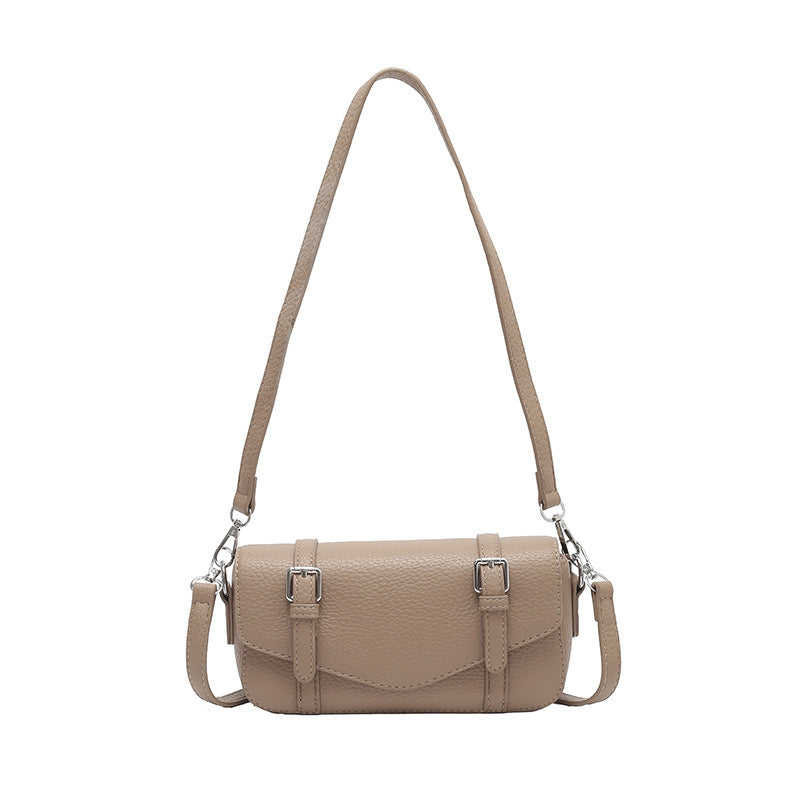 Women's elegant shoulder bag made of textured synthetic leather with adjustable shoulder strap