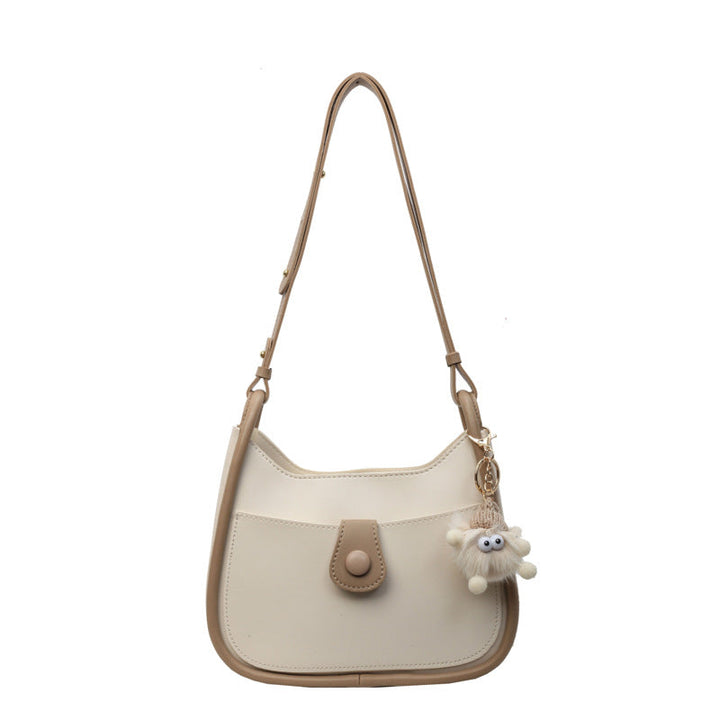 Women's shoulder bag made of high-quality synthetic leather with playful charm