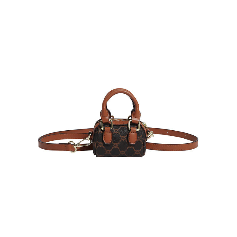 Ladies mini handbag with luxurious accents and adjustable shoulder strap