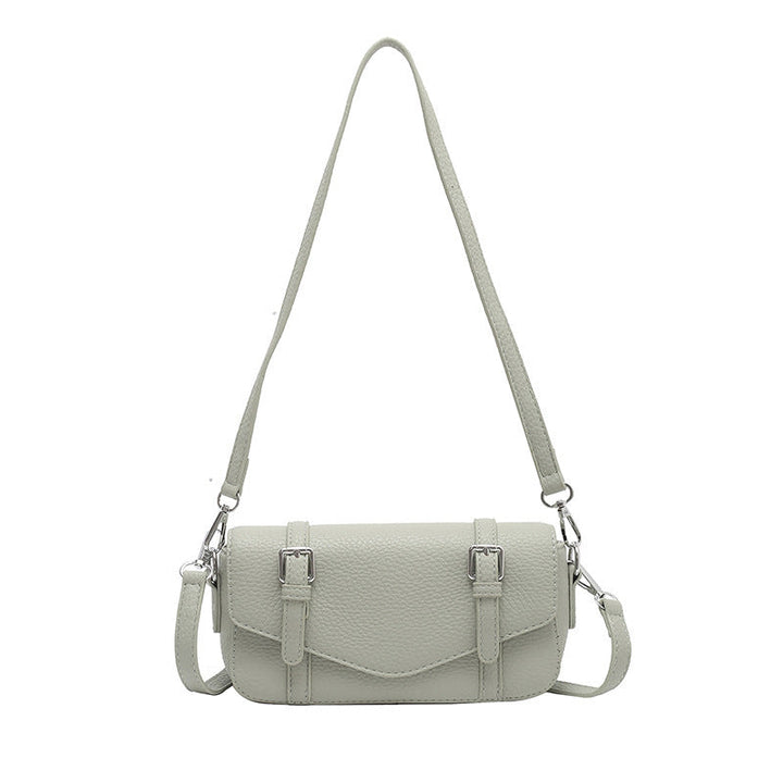 Women's elegant shoulder bag made of textured synthetic leather with adjustable shoulder strap