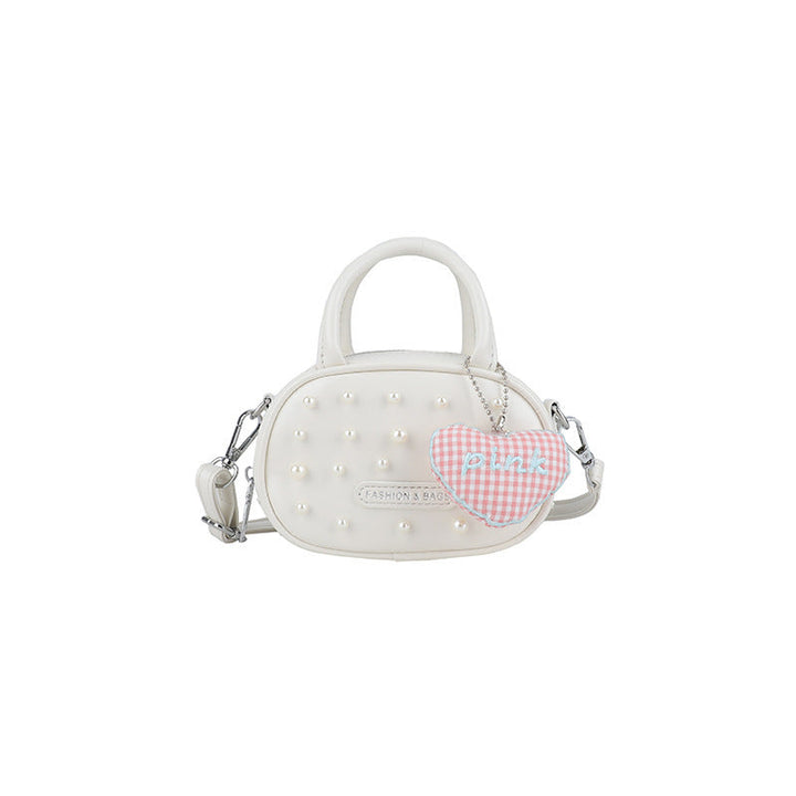 Ladies trendy mini handbag with striking pearl applications