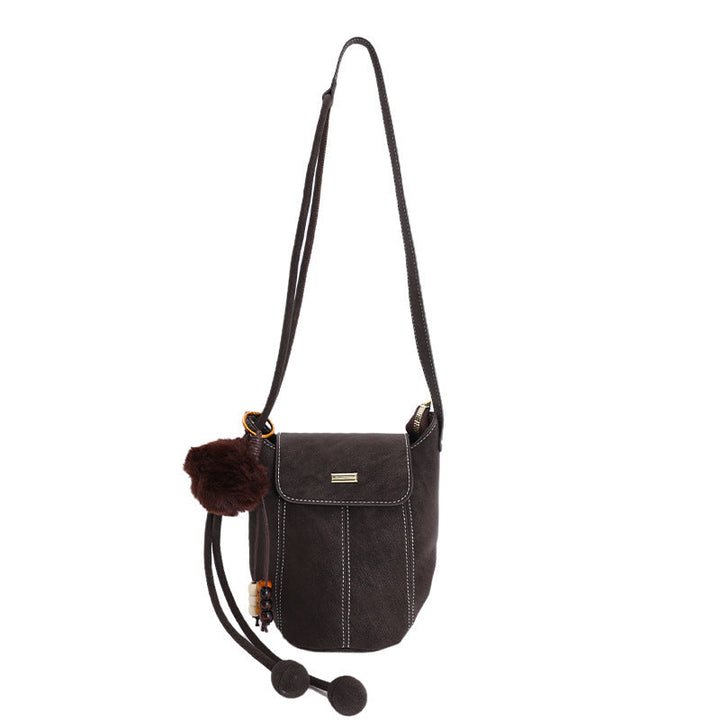 Ladies fashionable crossbody bag with fluffy pendant