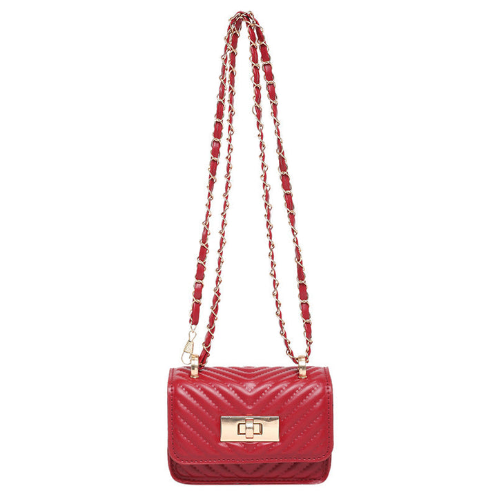 Women’s mini handbag with quilted design and golden clasp