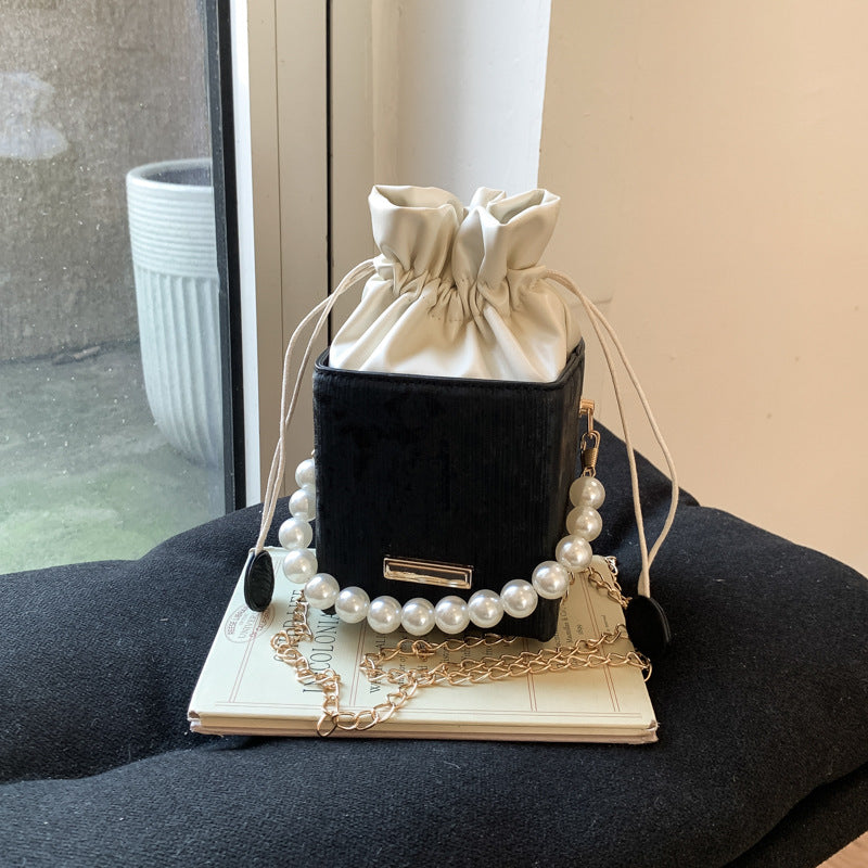 Ladies stylish mini handbag with drawstring and pearl accent