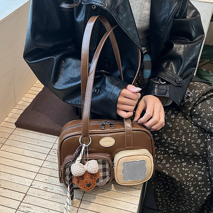 Women's shoulder bag with unique drawstring and charming pendant