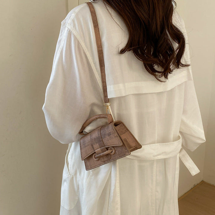Women's elegant mini handbag with textured design