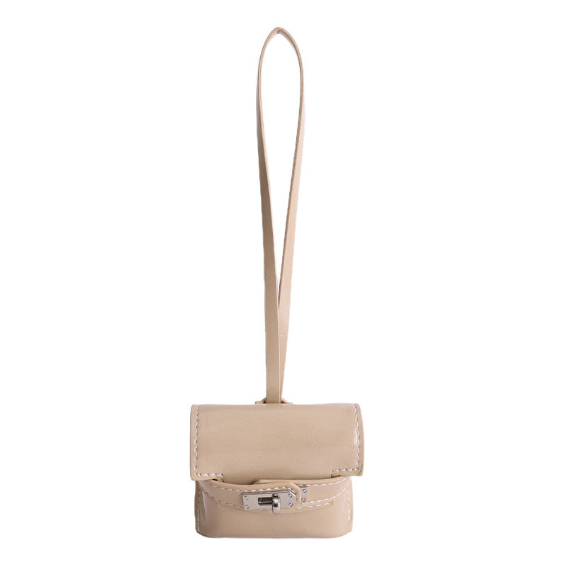 Ladies mini handbag made of high-quality artificial leather with playful closure