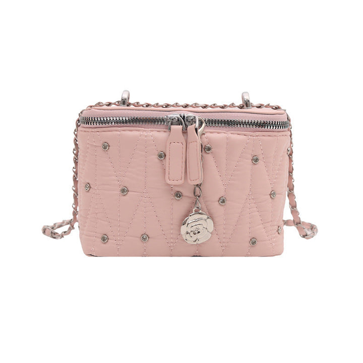 Women's mini handbag with elegant quilting and chain pendant