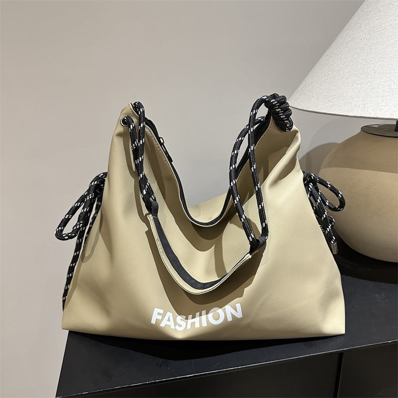 Women's stylish tote bag with braided drawstring