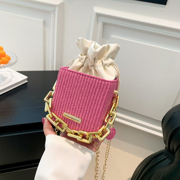 Women's mini handbag with unique chain embellishment and classic drawstring