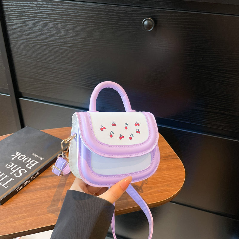 Women's mini handbag with cheerful cherry design and charming pendants
