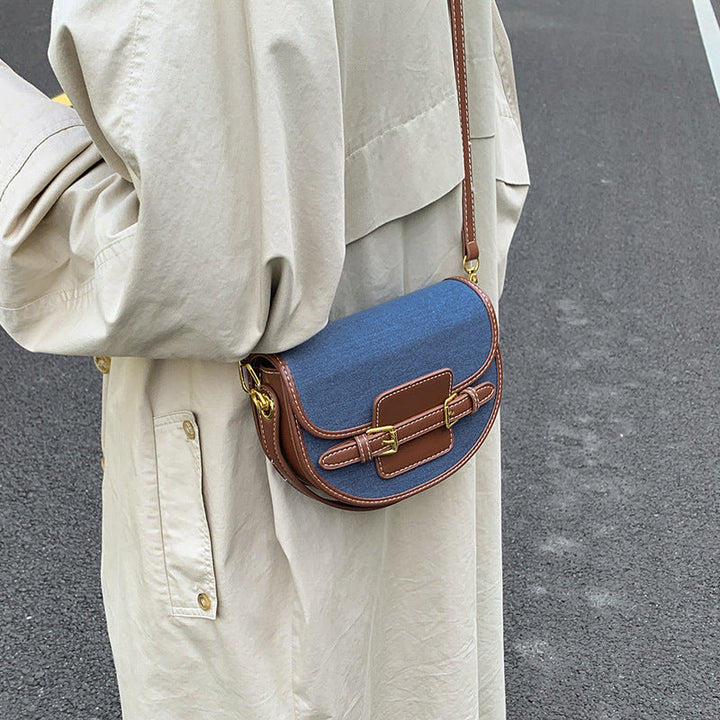 Women’s shoulder bag made of durable denim with leather accents