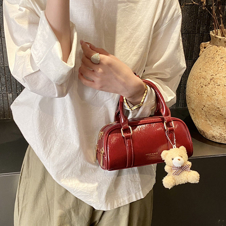Women's mini handbag with playful teddy pendant
