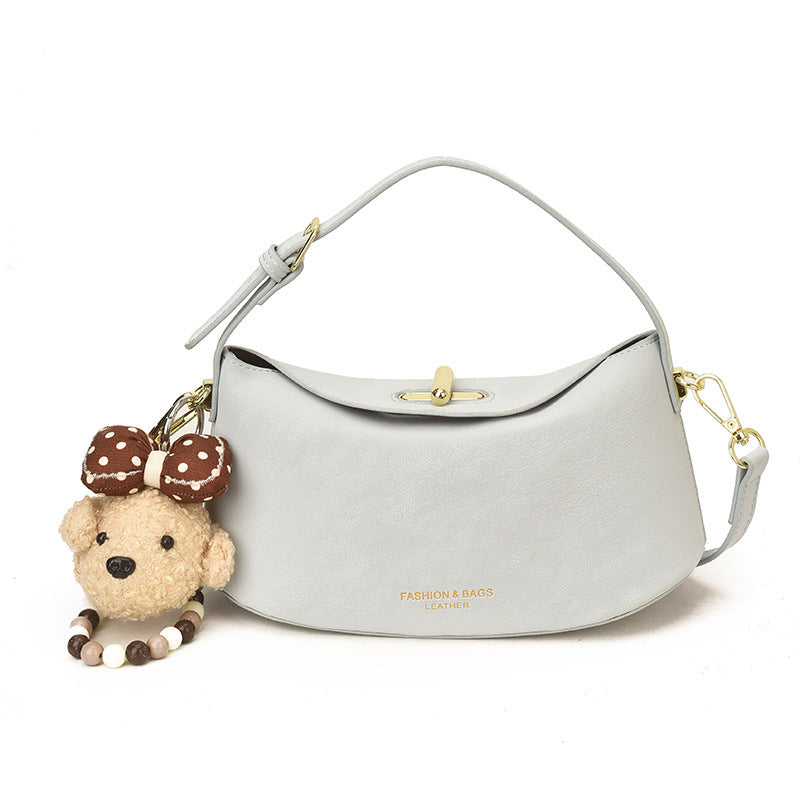 Women's shoulder bag with decorative pendant