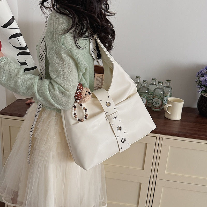 Ladies crossbody bag made of high-quality artificial leather with practical attachments