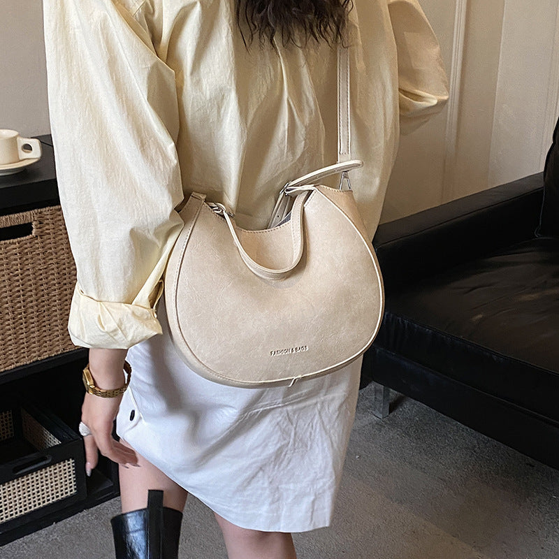 Women's shoulder bag made of high-quality artificial leather with fashionable trim