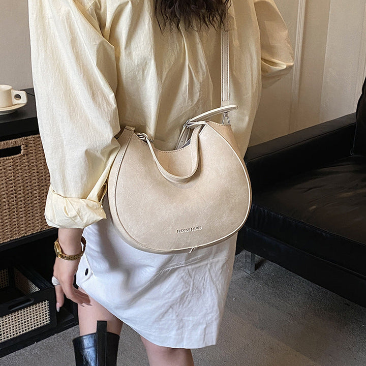 Women's shoulder bag made of high-quality artificial leather with fashionable trim