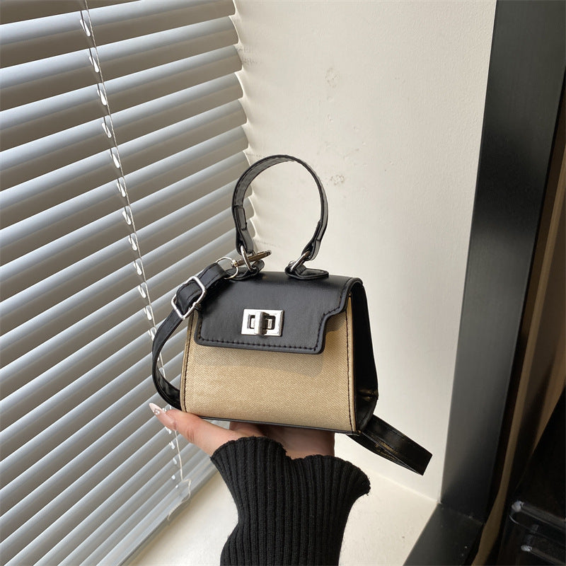 Ladies mini handbag with luxurious leather look and practical carrying handles