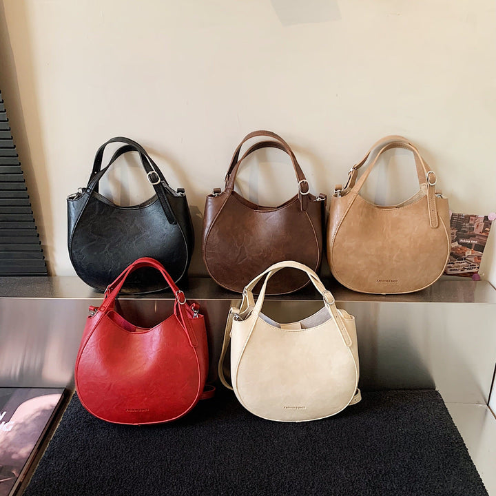 Women's shoulder bag made of high-quality artificial leather with fashionable trim