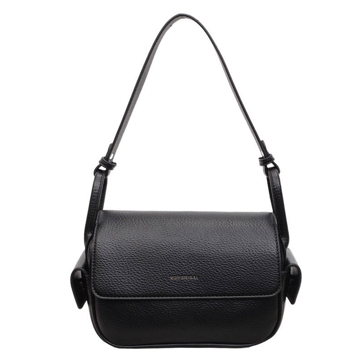 Women’s shoulder bag made of soft, textured leather with adjustable shoulder strap