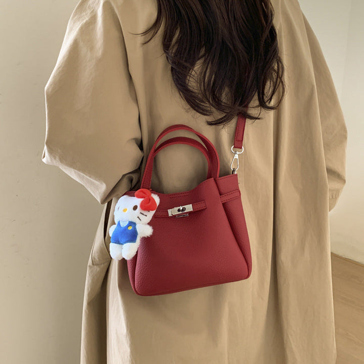 Ladies mini handbag with detachable cosmetic pouch