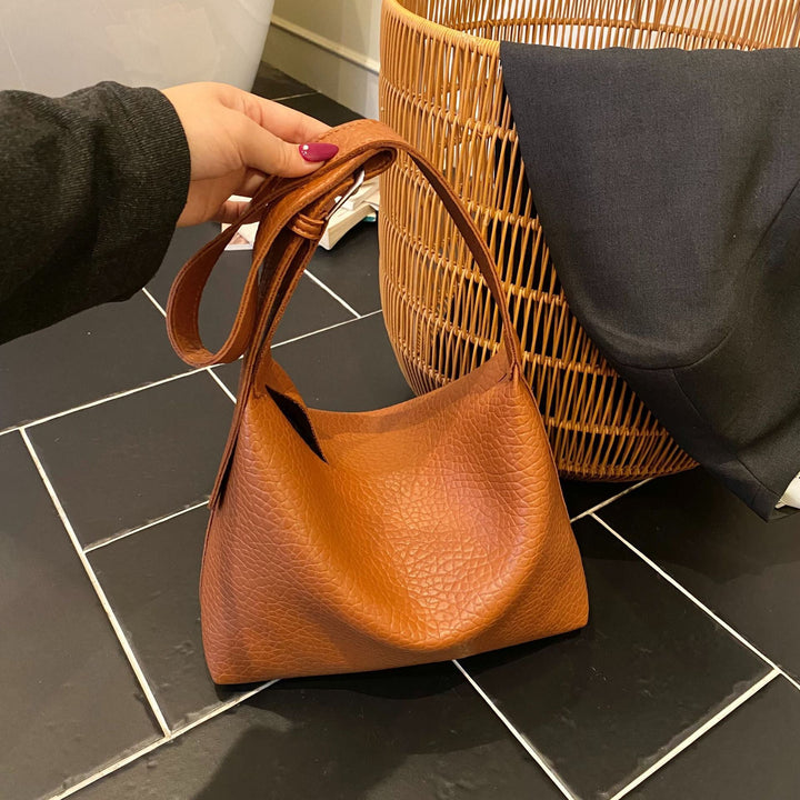 Women stylish shoulder bag with textured design
