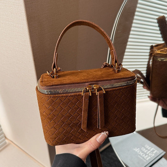 Women's structured shoulder bag with detachable carrying strap